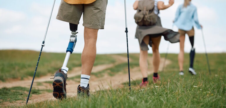 people hiking with prosthetic legs