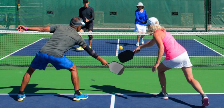senior couples playing pickleball