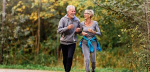 senior couple jogging outside