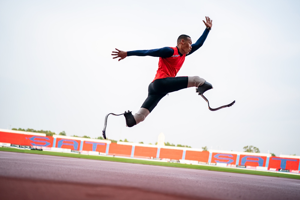 athlete jumping with running blades
